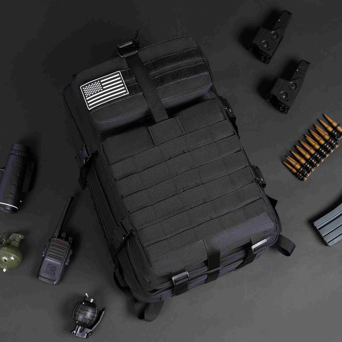 Black tactical backpack with American flag patch, MOLLE system, and tactical gear. 900D nylon.