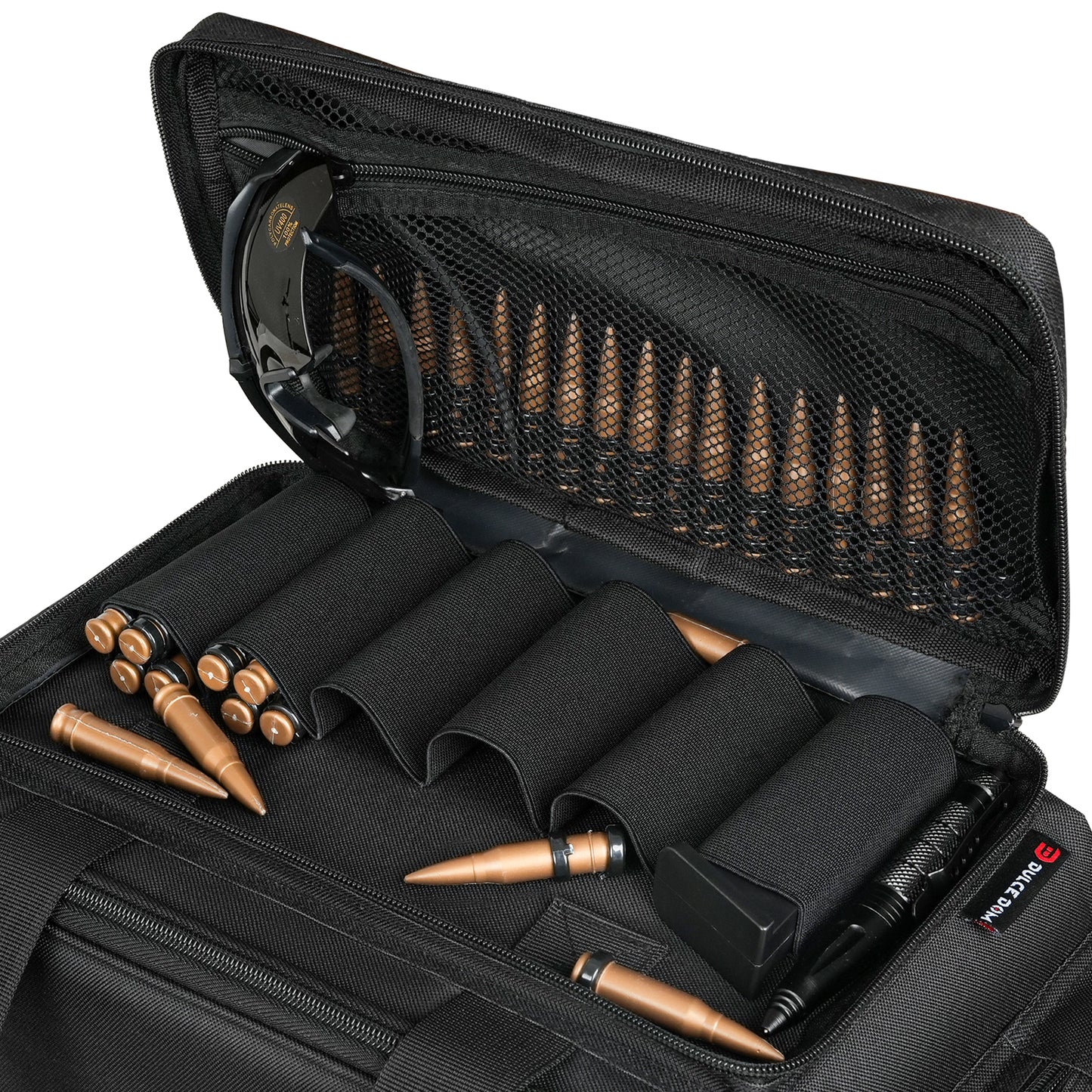 Dulce Dom Mini Range Bag open, showing firearm accessories and ammunition, black tactical bag.