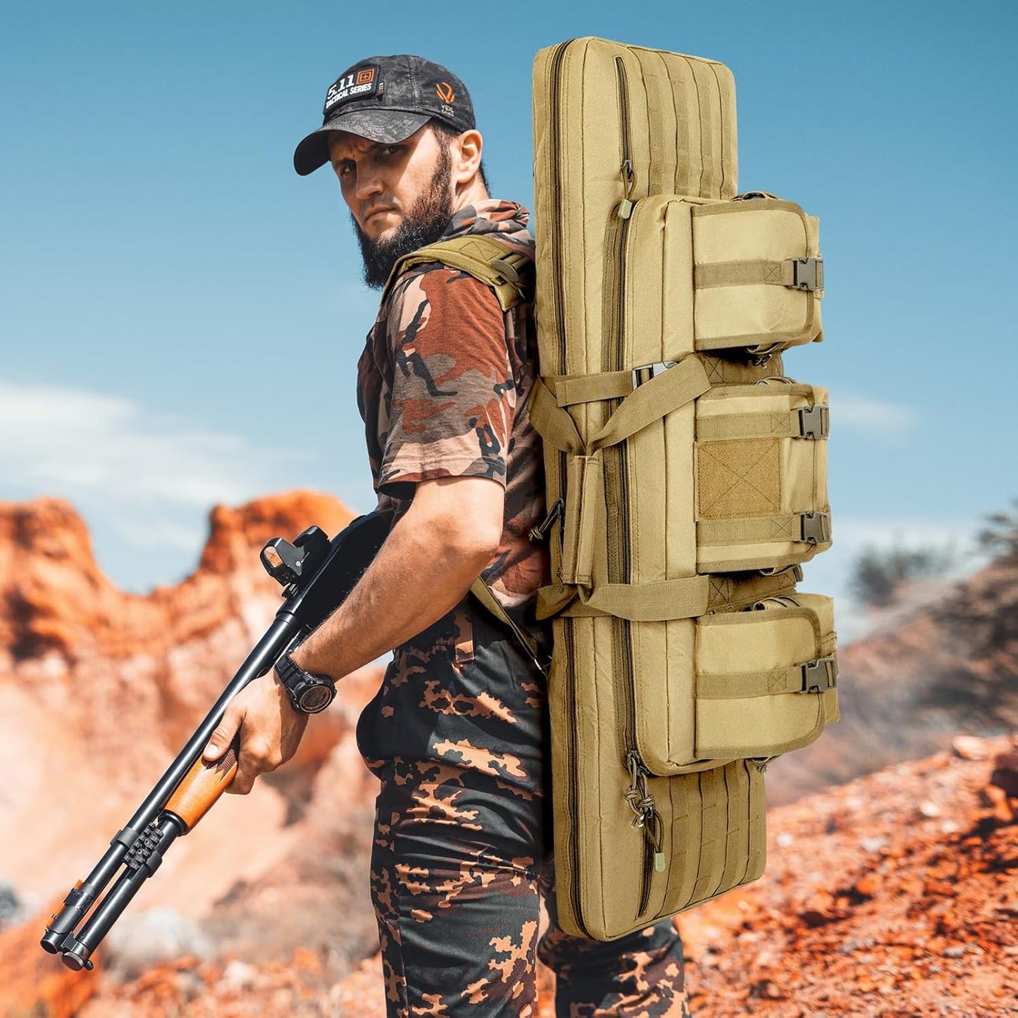DULCE DOM tan long gun bag carried as backpack by man with rifle. Featuring multiple MOLLE pockets, tactical gear.