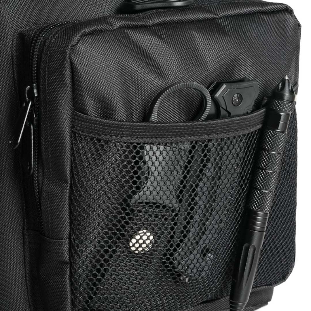 Black tactical gun range bag pocket with gear, featuring mesh pocket, accessories and pen.