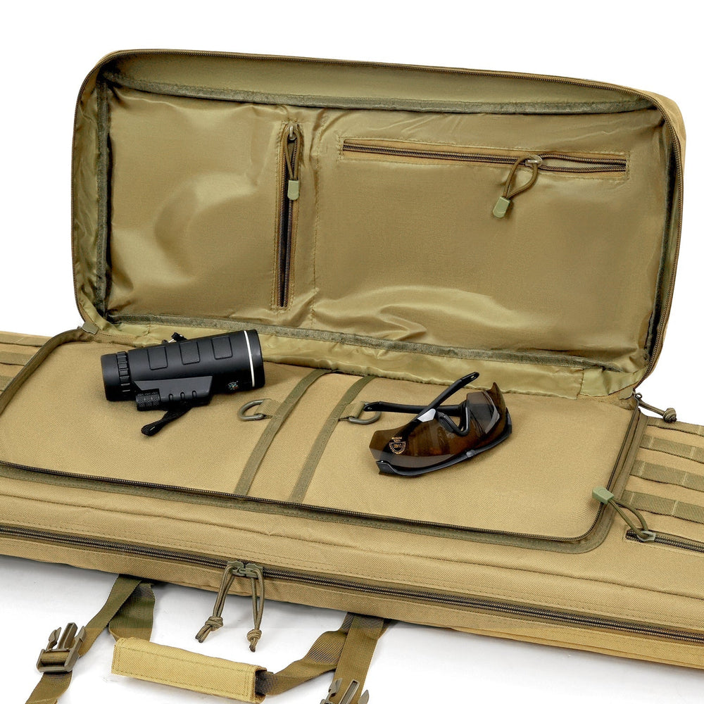 Interior view of an open, tan-colored soft rifle case with padded lining. A black monocular and dark shooting glasses are placed inside on the main compartment. Zippered pockets are visible on the inside of the lid