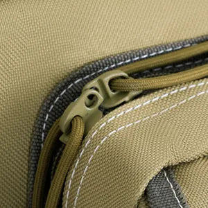 
                  
                    Khaki DULCE DOM Rifle Case detail: Oxford fabric zipper and paracord pulls for secure rifle transport
                  
                